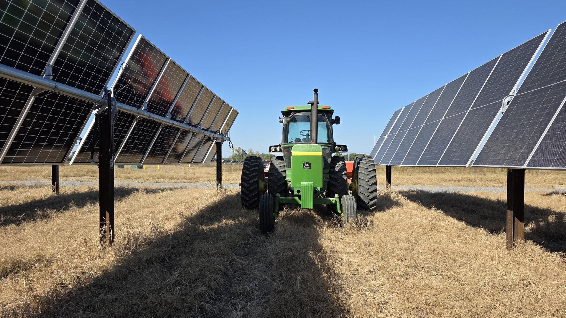 Image of Tractor in Solar Field - Agrivoltaics in Action, How Sol Systems Is Rewriting the Future of Land, Energy, and Agriculture